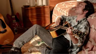 Jeremy Allen White as Bruce Springsteen during the Nebraska home-recording era in Springsteen: Deliver Me from Nowhere. Image via 20th Century Studios 