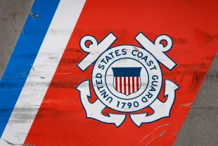 SAN DIEGO, CALIFORNIA - SEPTEMBER 26: A U.S. Coast Guard logo is displayed on the side of a patrol boat on September 26, 2025 in San Diego, California. (Photo by Kevin Carter/Getty Images)