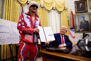 WASHINGTON, DC - MARCH 31: U.S. President Donald Trump, accompanied by entertainer Kid Rock, signs an executive order in the Oval Office of the White House on March 31, 2025 in Washington, DC. Trump has signed an executive order against ticket scalping and reforming the live entertainment ticket industry. (Photo by Andrew Harnik/Getty Images)