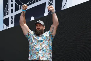 WWE wrestler Braun Strowman walks onstage during pre-race ceremonies prior to the NASCAR Cup Series Toyota / Save Mart 350 (Image via Getty)