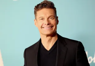 Ryan Seacrest, host of Celebrity Wheel of Fortune (Image via Getty)