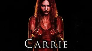 Carrie White, drenched in blood, stares ahead against a stark black background. (Image via Netflix)