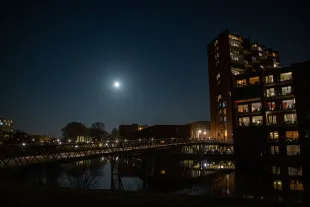 Snow Moon of February 2021 rises over a residential area. The full moon of earth natural satellite as seen illuminating the lunar light in the night sky of Europe. February's full moon, traditionally known as the Snow Moon rises over Eindhoven in the Netherlands. Eindhoven, Netherlands on February 27, 2021 (Photo by Nicolas Economou/NurPhoto via Getty Images)