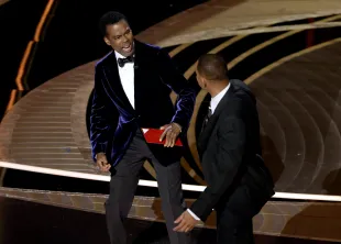 HOLLYWOOD, CALIFORNIA - MARCH 27: Will Smith appears to slap Chris Rock onstage during the 94th Annual Academy Awards at Dolby Theatre on March 27, 2022 in Hollywood, California. (Photo by Neilson Barnard/Getty Images)