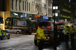 GLASGOW, SCOTLAND - DECEMBER 22: Emergency services attend the scene near a cordon off crashed bin lorry in George Square on December 22, 2014 in Glasgow, Scotland. There are reports of a number of fatalities and substantial casualties after a bin lorry appears to have crashed into pedestrians in George Square.  (Photo by Mark Runnacles/Getty Images)