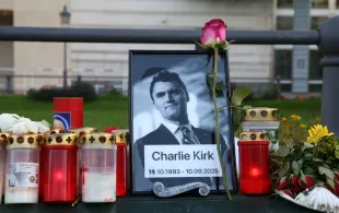 BERLIN, GERMANY - SEPTEMBER 14: Flowers and candles are seen at a makeshift memorial for murdered American conservative activist Charlie Kirk outside the U.S. embassy as its flag hangs at half-staff on September 14, 2025 in Berlin, Germany. Thirty-one-year-old Kirk was shot and killed four days earlier at a discussion event at Utah Valley University just moments after he began his speech. Members of the right-wing Alternative for Germany (AfD) party held a memorial service in front of the U.S. embassy. (Photo by Adam Berry/Getty Images)