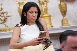 White House Deputy Chief of Staff Stephen Miller's wife, Katie Miller, listens as U.S. President Donald Trump and Tesla CEO Elon Musk speak to reporters in the Oval Office of the White House on May 30, 2025 in Washington, DC. (Photo by Kevin Dietsch/Getty Images)