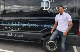 Floyd Roger Myers standing with his Dr. Duct truck (Image via Facebook/Floyd Rocwonder Myers Jr.)