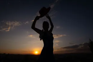 ANKARA, TURKIYE - AUGUST 28: A view of the silhouette of a flamenco dancer dancing in front of the reddish sky during sunset at 50th Anniversary Park in Ankara, Turkiye on August 28, 2024. (Photo by Betul Abali /Anadolu via Getty Images)