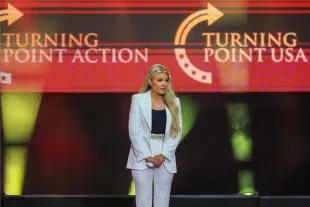 GLENDALE, ARIZONA - SEPTEMBER 21: Mrs. Erika Kirk appears onstage during the memorial service for her husband, political activist Charlie Kirk at State Farm Stadium on September 21, 2025 in Glendale, Arizona. Kirk, the CEO and co-founder of Turning Point USA, was shot and killed on September 10th while speaking at an event during his "American Comeback Tour" at Utah Valley University. (Photo by Joe Raedle/Getty Images)