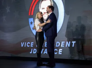 OXFORD, MS - OCTOBER 29:  Erika Kirk, widow of Turning Point USA founder Charlie Kirk, and U.S. Vice President JD Vance embrace on stage during a Turning Point USA event at the Pavilion at Ole Miss at the University of Mississippi, on October 29, 2025 in Oxford, Mississippi. The visit marks the first stop on the “This Is the Turning Point” campus tour, led by Kirk’s widow, Erika Kirk.  (Photo by Jonathan Ernst-Pool/Getty Images)