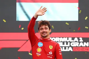 MONZA, ITALY - SEPTEMBER 01: Race winner Charles Leclerc of Monaco and Ferrari celebrates on the podium during the F1 Grand Prix of Italy at Autodromo Nazionale Monza on September 01, 2024 in Monza, Italy. (Photo by Clive Rose/Getty Images)