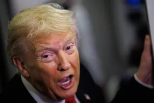 WEST PALM BEACH, FLORIDA - NOVEMBER 02: U.S. President Donald Trump speaks to reporters aboard Air Force One en route to the White House on November 2, 2025 after taking off from Palm Beach International Airport in West Palm Beach, Florida. Trump spent the weekend at his Mar-A-Lago estate in Palm Beach, Florida. (Photo by Samuel Corum/Getty Images)