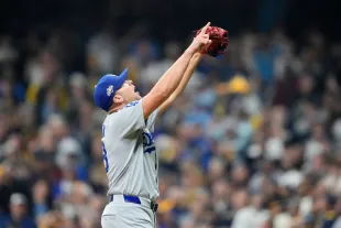 MILWAUKEE, WISCONSIN - OCTOBER 13: Blake Treinen #49 of the Los Angeles Dodgers celebrates after beating the Milwaukee Brewers 2-1 in game one of the National League Championship Series at American Family Field on October 13, 2025 in Milwaukee, Wisconsin. (Photo by Patrick McDermott/Getty Images)