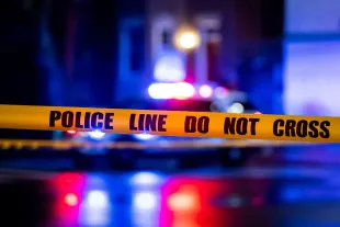 WASHINGTON, DC - MARCH 12: Caution tape hangs as members of the Metropolitan Police Department investigate a shooting between two cars at the 400 block of 11th Street SE, on Sunday, March 12, 2023. One male was pronounced dead at the scene and a second male succumbed to their injuries on the way to the hospital. (Photo by Al Drago for The Washington Post via Getty Images)