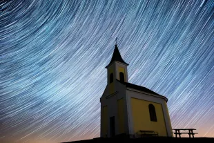 NIEDERHOLLABRUNN, AUSTRIA - APRIL 21: (EDITORS NOTE: Multiple exposures were combined to produce this image.) Startrails are seen during the Lyrids meteor shower over Michaelskapelle on April 20, 2020 in Niederhollabrunn, Austria. The clear skies created by the New Moon coincide with the Lyrid meteor shower, an annual display caused by the Earth passing through a cloud of debris from a comet called C/186 Thatcher. (Photo by Thomas Kronsteiner/Getty Images)