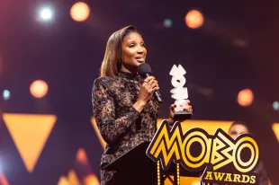 NEWCASTLE UPON TYNE, ENGLAND - FEBRUARY 18: Denise Lewis receives the MOBO Paving The Way Award during the MOBO Awards 2025 at the Utilita Arena on February 18, 2025 in Newcastle upon Tyne, England. (Photo by Joseph Okpako/WireImage)