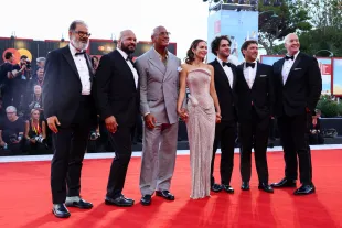 VENICE, ITALY - SEPTEMBER 01: (L-R) Andrea Romeo, Mark Kerr, Dwayne Johnson, Emily Blunt, Benny Safdie, David Koplan and Hiram Garcia attend "The Smashing Machine" red carpet during the 82nd Venice International Film Festival on September 01, 2025 in Venice, Italy. (Photo by Aldara Zarraoa/Getty Images)