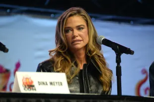 LOS ANGELES, CALIFORNIA - SEPTEMBER 28: Denise Richards speaks during 2025 Los Angeles Comic-Con at Los Angeles Convention Center on September 28, 2025 in Los Angeles, California. (Photo by Jody Cortes/Getty Images)