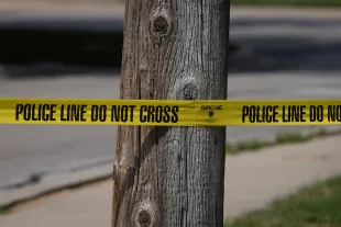 FRANKLIN PARK, ILLINOIS - SEPTEMBER 12: Police tape blocks off an area as investigators collect evidence after a man crashed his vehicle after being fatally shot during a confrontation with ICE officers on September 12, 2025 in Franklin Park, Illinois. The Chicago area has seen a surge in ICE activity recently, part of the Trump administration's crackdown on undocumented immigrants in the area dubbed "Operation Midway Blitz".    (Photo by Scott Olson/Getty Images)