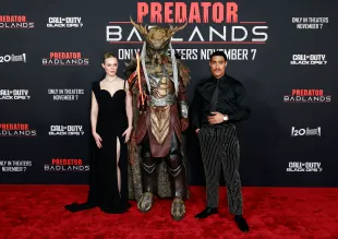 Elle Fanning and Dimitrius Schuster-Koloamatangi attend the World Premiere of 20th Century Studios "Predator: Badlands" at TCL Chinese Theatre on November 03, 2025 in Hollywood, California. (Photo by Frazer Harrison/WireImage)
