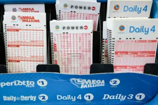 Hawthorne, CA - October 10: Powerball and California Lottery games on display at Blue Bird Liquor in Hawthorne, CA, Tuesday, Oct. 10, 2023. The estimated jackpot for tonight's Powerball drawing is $1.73 Billion.(Jay L. Clendenin / Los Angeles Times via Getty Images)