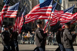 NEW YORK, NEW YORK - NOVEMBER 11: People participate in the 105th annual Veterans Day Parade on November 11, 2024, in New York City. Hundreds of people lined 5th Avenue to watch the biggest Veterans Day parade in the United States. This year's event included veterans, active soldiers, police officers, firefighters, and dozens of school groups participating in the parade, which honors the men and women who have served and sacrificed for the country.  (Photo by Spencer Platt/Getty Images)
