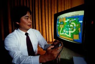 Shigeru Miyamoto, creator of Mario and other characters and video games for Nintendo, plays Super Mario World on a Nintendo Super NES System. (Photo by © Ralf-Finn Hestoft/CORBIS/Corbis via Getty Images)