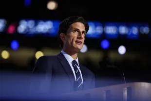 Jack Schlossberg, grandson of former U.S. President John F. Kennedy, speaks on stage (Image via Getty)