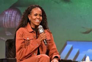 AUSTIN, TEXAS - MARCH 13: Michelle Obama speaks onstage at IMO Live: Michelle Obama, Craig Robinson & Dr. Laurie Santos during the 2025 SXSW Conference and Festival at Austin Convention Center on March 13, 2025 in Austin, Texas. (Photo by Marcus Ingram/Getty Images)
