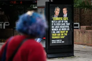 LONDON, ENGLAND - SEPTEMBER 03: Members of the public read the latest in a series of posters highlighting US President Donald Trump's relationship with dead sex trafficker Jeffrey Epstein, on September 03, 2025 in London, England, ahead of Trump's state visit planned for later this month. The protest group that calls itself 'Everyone Hates Elon' has gained notoriety by employing guerrilla tactics to install satirical 'ads' at bus stops across London and other venues that target political figures, with an initial focus on Elon Musk during his time in the Trump administration. Last month they orchestrated the installation of a viral meme depicting a distorted image of JD Vance on a poster in the Cotswolds, during the US Vice President's UK holiday. (Photo by Leon Neal/Getty Images)