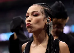 MADRID, SPAIN - NOVEMBER 16: Karina Pasian blows a kiss before performing the national anthem prior to the NFL 2025 game between Washington Commanders and Miami Dolphins at Estadio Santiago Bernabeu on November 16, 2025 in Madrid, Spain. (Photo by Florencia Tan Jun/Getty Images)