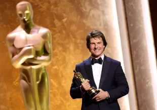 HOLLYWOOD, CALIFORNIA - NOVEMBER 16: Honoree Tom Cruise poses onstage during the 16th Governors Awards at The Ray Dolby Ballroom on November 16, 2025 in Hollywood, California. (Photo by Kevin Winter/Getty Images)