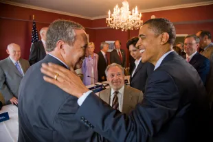 Democratic presidential candidate Senator Barack Obama, greets former Treasury Secretary Lawrence (Larry) Summers during a meeting with his economic advisors, in Washington DC, as Robert Reich (C), former Labor Secretary under Clinton, looks on. (Photo by Brooks Kraft LLC/Corbis via Getty Images)