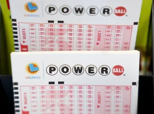 LOS ANGELES, CALIFORNIA - JULY 18: Powerball play slips are displayed in a convenience store on July 18, 2023 in Los Angeles, California. The Powerball jackpot for the drawing on July 19th is now estimated to be $1 billion after three months of drawings without a winner. (Photo by Mario Tama/Getty Images)