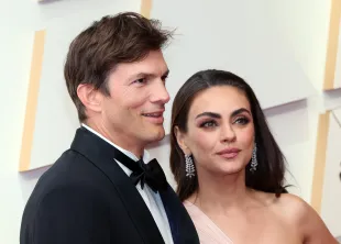 Ashton Kutcher and Mila Kunis attend the 94th Annual Academy Awards at Hollywood and Highland (Image via Getty)