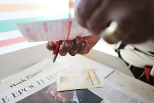 LOS ANGELES, CA - OCTOBER 16:  A woman prepares a slip for the Mega Millions lottery jackpot on October 16, 2018 in Los Angeles, California. Today's Mega Millions jackpot is at least $654 million and combined with a high Powerball jackpot the total winnings could top $1 billion.  (Photo by Mario Tama/Getty Images)