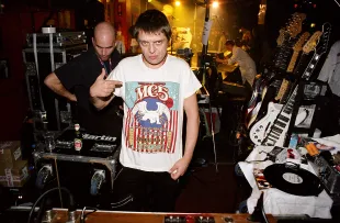 LONDON, ENGLAND - MARCH 13:  Mani of Primal Scream dj's during the reunion show 'Sonic Revolution: A Celebration Of The MC5' at the 100 Club on March 13, 2003 in London, United Kingdom.  (Photo by Jim Dyson/Getty Images)