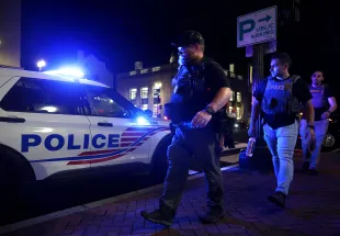 WASHINGTON, DC - AUGUST 13: Members of DEA patrol on M Street in Georgetown on August 13, 2025 in Washington, DC. U.S. President Donald Trump announced plans to deploy federal officers and the National Guard to the District in order to place the DC Metropolitan Police Department under federal control and assist in crime prevention in the nation's capital.  (Photo by Alex Wong/Getty Images)