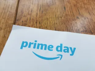 Close-up of logo for Amazon Prime day on a light wooden surface, San Ramon, California, July 18, 2018. (Photo by Smith Collection/Gado/Getty Images)