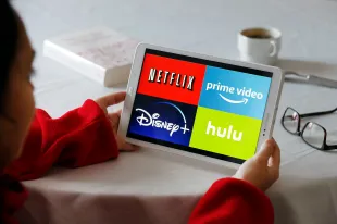 PARIS, FRANCE - NOVEMBER 20: In this photo illustration, the logos of media service providers, Netflix, Amazon Prime Video, Disney + and Hulu are displayed on the screen of a tablet on November 20, 2019 in Paris, France. Amazon Prime video is a major player in streaming as its competitors, Disney, Netflix, Disney +, HBO and Apple TV. (Photo by Chesnot/Getty Images)