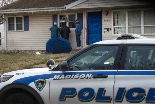 MADISON, WISCONSIN - DECEMBER 17: Workers repair the home of 15-year-old Natalie Rupnow that was reported to have been damaged as police made entry yesterday on December 17, 2024 in Madison, Wisconsin. Rupnow is reported to have been the student who opened fire at Abundant Life Christian School yesterday, shooting multiple people and killing at least two before killing herself. (Photo by Scott Olson/Getty Images)