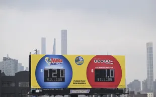 NEW YORK, US - JULY 19: Lottery advertising signs are seen as US Powerball jackpot grand prize grew to a whopping $1 billion after no ticket got all six numbers on July 19, 2023 in New York, USA. (Photo by Fatih Aktas/Anadolu Agency via Getty Images)