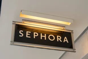 Illuminated hanging Sephora store sign under ceiling overhang, San Francisco, California, August 14, 2025. (Photo by Smith Collection/Gado/Getty Images)