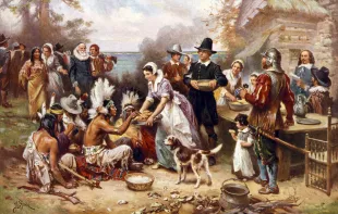 The First Thanksgiving in 1621, after a painting by Jean Leon Gerome; screen print, 1932 (Image via Getty)