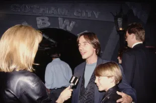 American singer-songwriter and musician Jackson Browne and his son, Ethan Browne, interviewed by an an E! interviewer at the Hollywood premiere of 'Batman Returns' (Image via Getty)