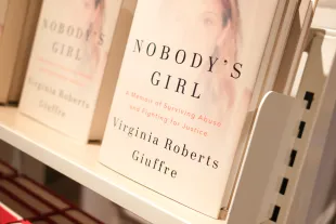 LONDON, ENGLAND - OCTOBER 21: 'Nobody's Girl' by Virginia Giuffre on display at Foyles Bookshop on October 21, 2025 in London, England. 'Nobody's Girl,' the posthumous memoir by Virginia Giuffre, has released in bookstores today - six months after the sex-trafficking victim and abuse survivor advocate took her own life at her home in Australia, aged 41. Early reviews of the book detail Giuffre's accounts of sexual abuse as a teenager by convicted sex offender Jeffrey Epstein and his former girlfriend Ghislaine Maxwell, as well as claims of rape by Britain's Prince Andrew. Last week Prince Andrew relinquished use of his titles and honors as new allegations against him have surfaced around his ties to Epstein. The Prince has denied the accusations against him. (Photo by Ming Yeung/Getty Images)