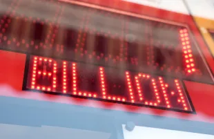 LOS ANGELES, CALIFORNIA - JULY 18: A California Lottery display shows projected winnings for the next Powerball drawing in a convenience store on July 18, 2023 in Los Angeles, California. The Powerball jackpot for the drawing on July 19th is now estimated to be $1 billion after three months of drawings without a winner. (Photo by Mario Tama/Getty Images)