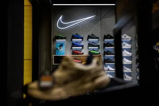 BANGKOK, THAILAND - APRIL 03: Nike shoes are displayed at the Nike store at Siam Center mall on April 03, 2025 in Bangkok, Thailand. U.S. President Donald Trump's "Liberation Day" tariffs have driven down the share prices of consumer goods companies like Nike, as higher import costs from affected countries are expected to squeeze profit margins and lead to increased retail prices, reducing consumer demand in the U.S. (Photo by Lauren DeCicca/Getty Images)