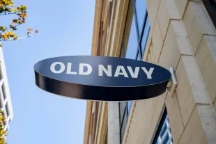 Old Navy oval storefront sign projecting from building facade on a sunny day, San Francisco, California, August 29, 2025. (Photo by Smith Collection/Gado/Getty Images)